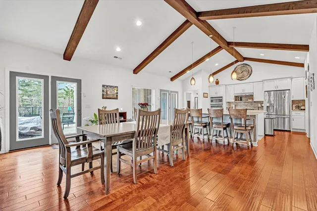 a view of a livingroom with furniture and a flat screen tv