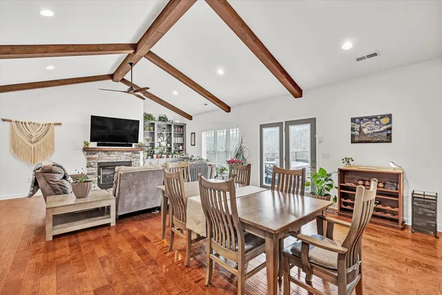 a large kitchen with a table and chairs