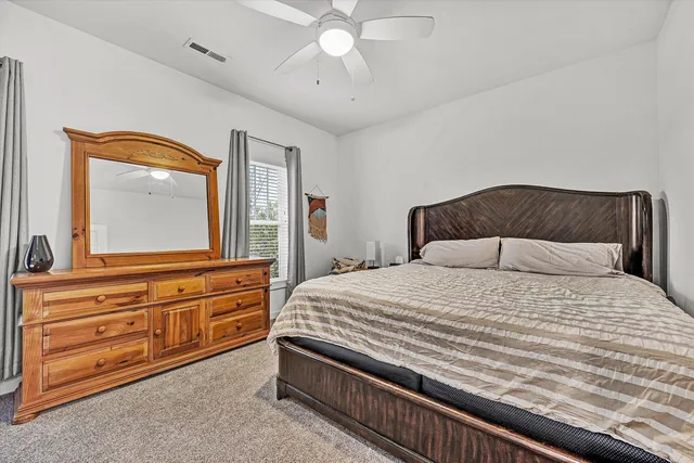 a bed room with a bed and a window