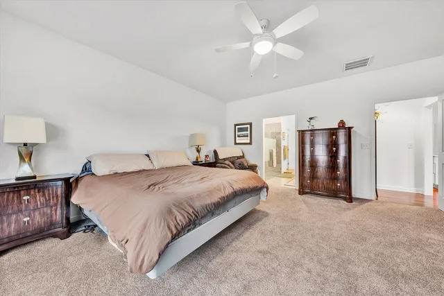 a bathroom with a glass shower door and a sink