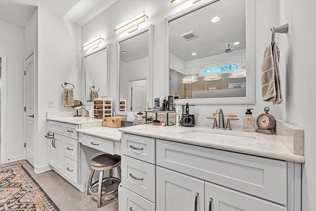 a view of walk in closet with clothes