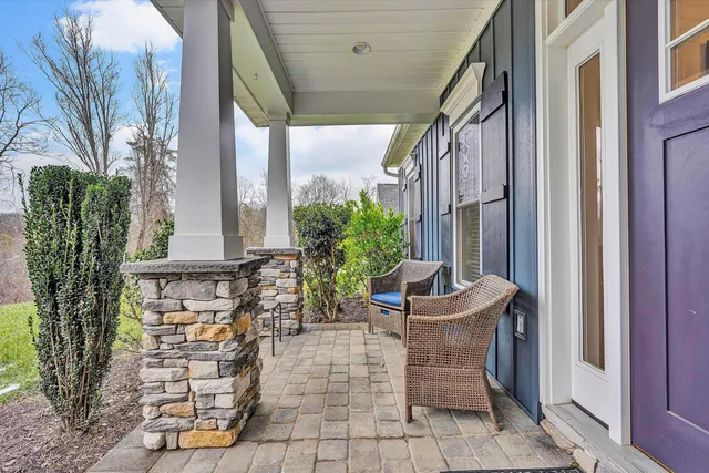a view of a chair and table in the balcony