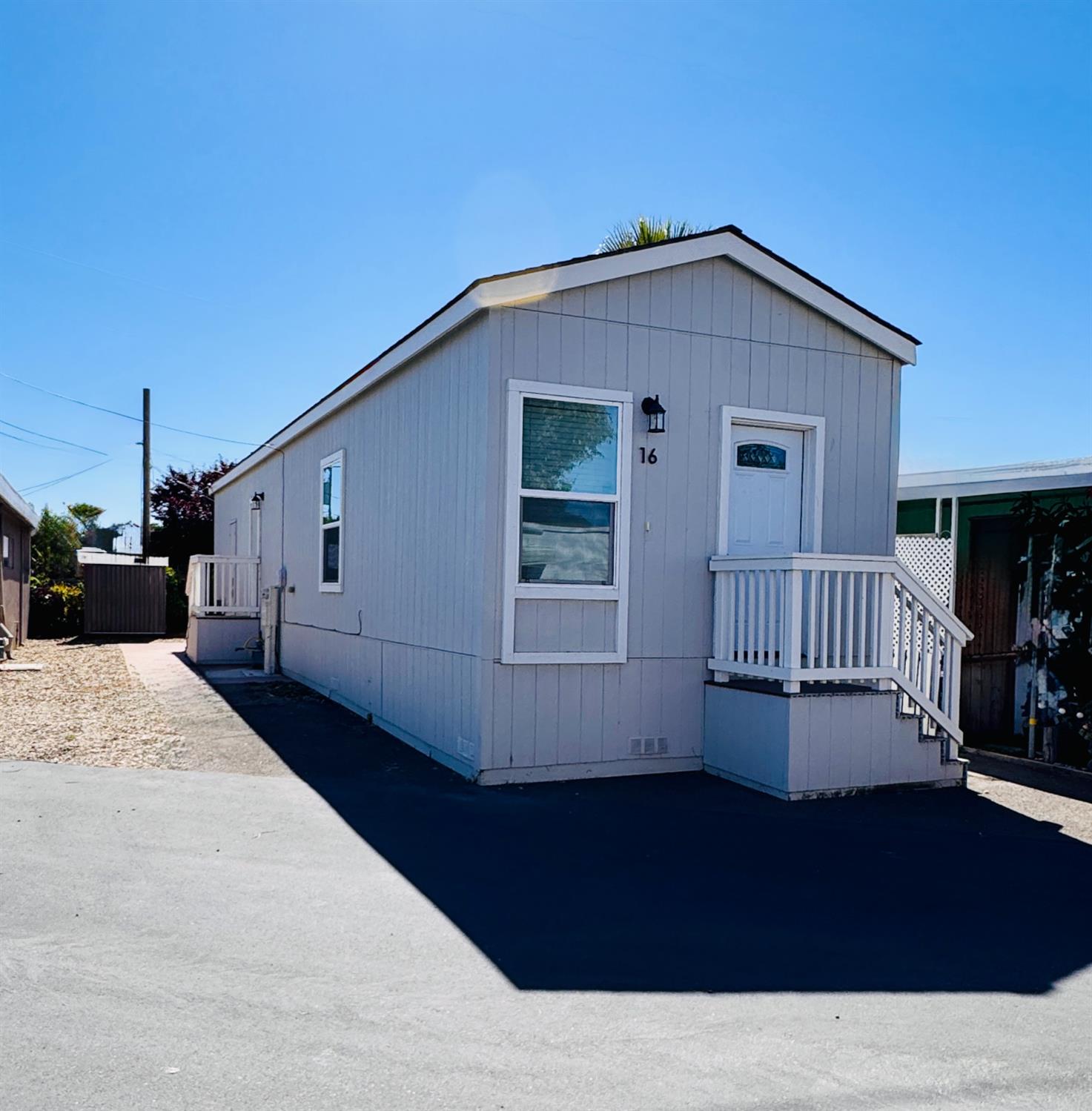 360 East Grant Line Road, Unit 16 Tracy, CA 95376 - Photo 20 of 36 Light gray siding exterior with white trim