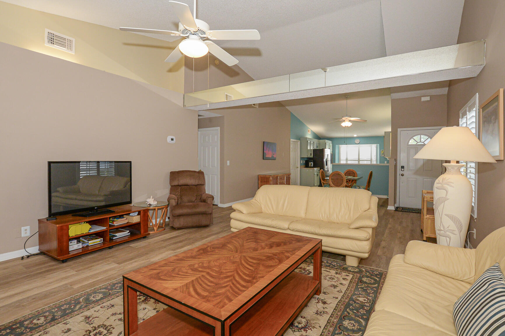 4064 Gator Trace Road Fort Pierce, FL 34982 - Photo 11 of 37 a living room with furniture and a flat screen tv