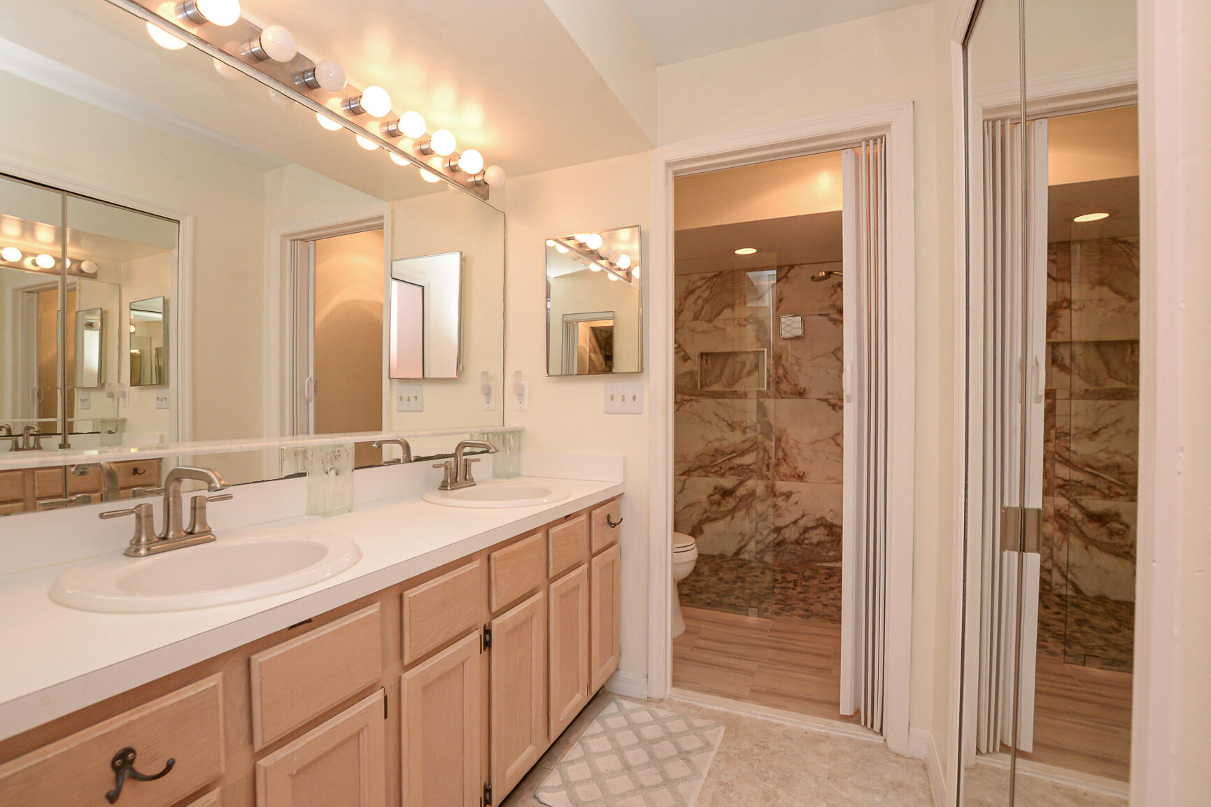 4064 Gator Trace Road Fort Pierce, FL 34982 - Photo 14 of 37 a bathroom with a double vanity sink and a mirror