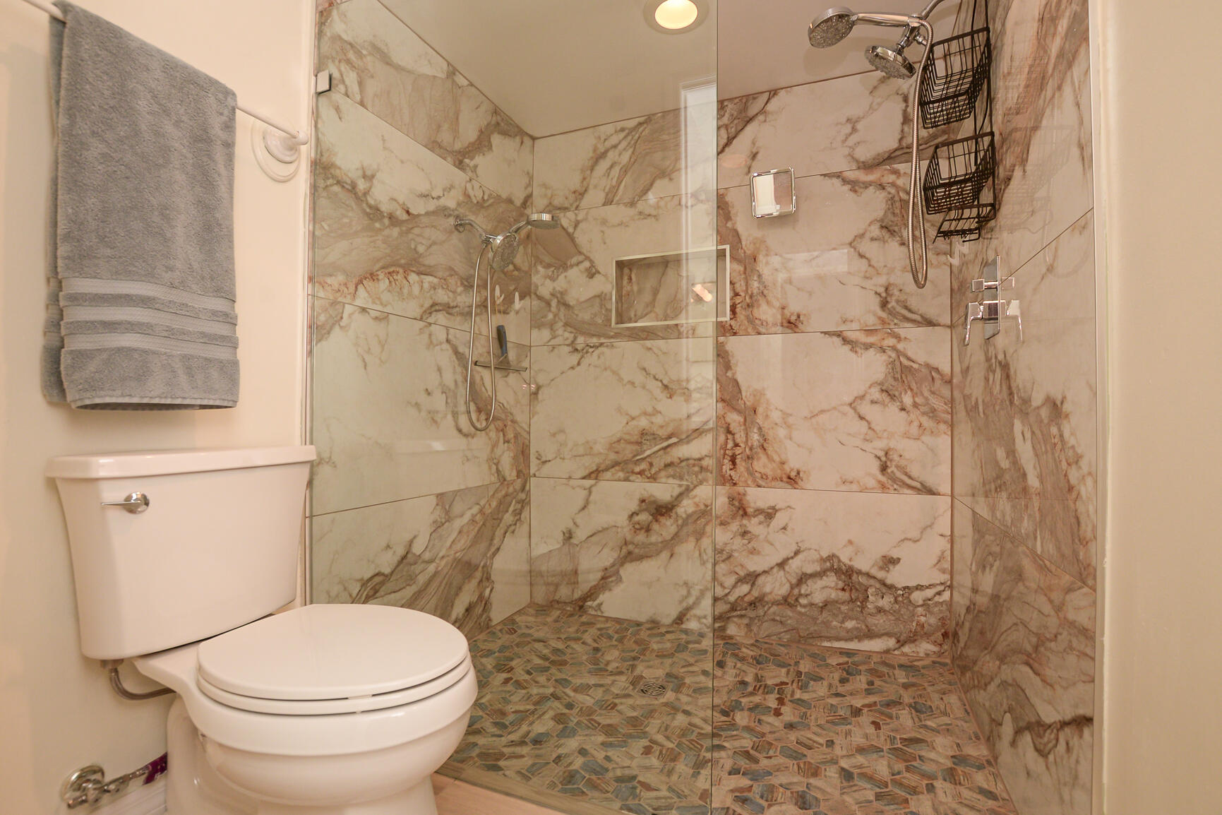 4064 Gator Trace Road Fort Pierce, FL 34982 - Photo 15 of 37 a white toilet sitting next to a shower curtain