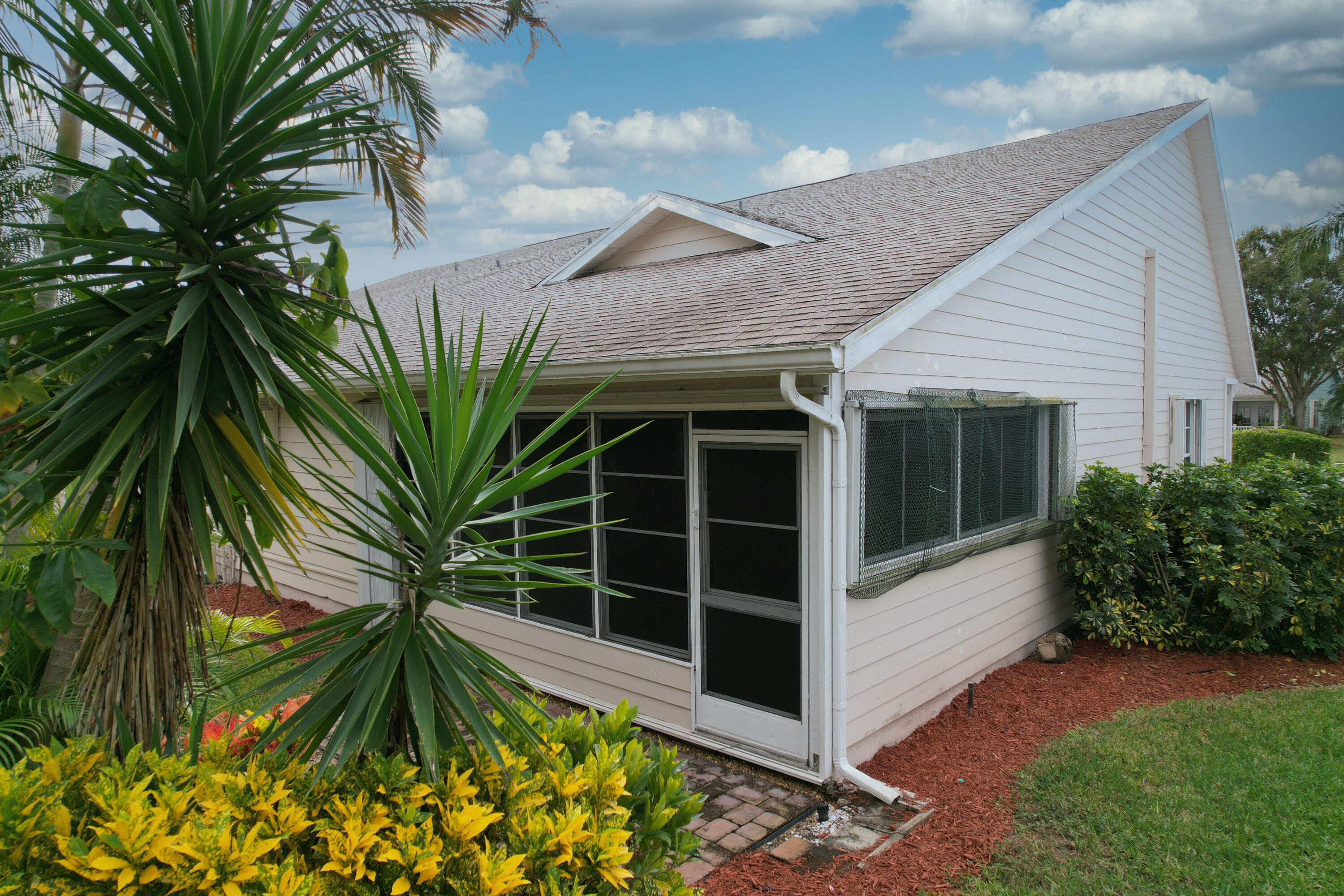 4064 Gator Trace Road Fort Pierce, FL 34982 - Photo 19 of 37 a view of front door and potted plants