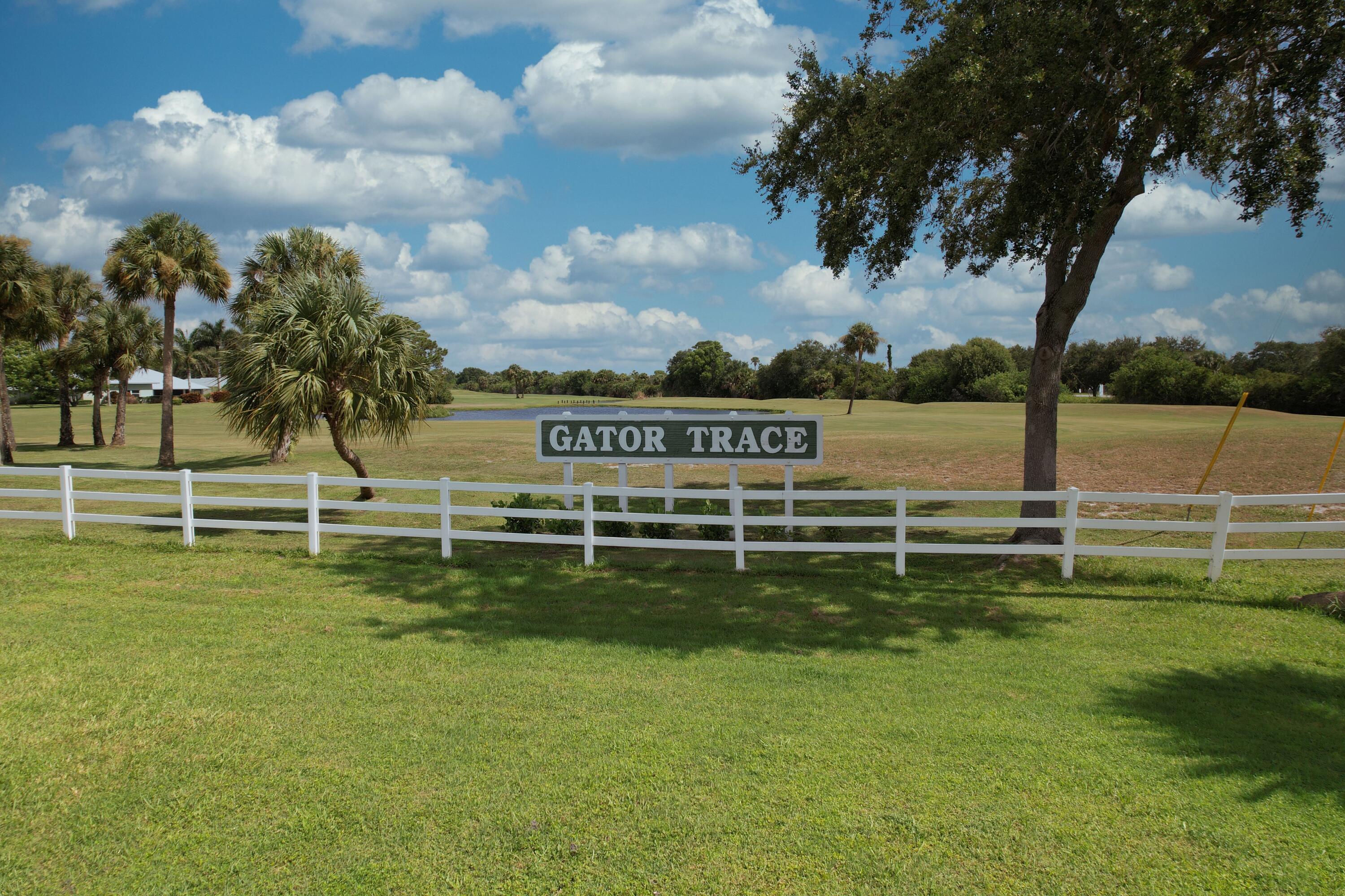 4064 Gator Trace Road Fort Pierce, FL 34982 - Photo 23 of 37 a view of a golf course with a lake view