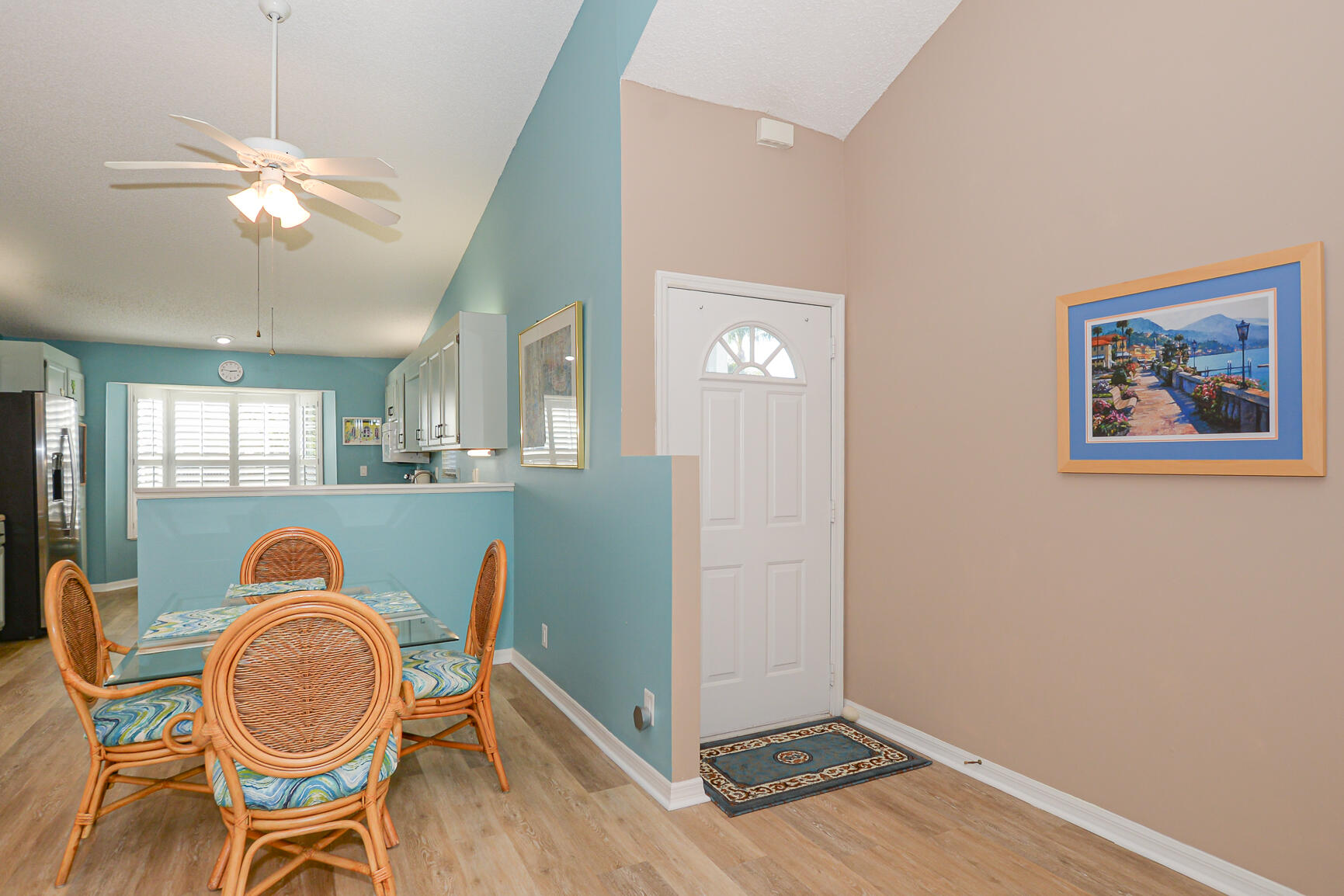 4064 Gator Trace Road Fort Pierce, FL 34982 - Photo 4 of 37 a dining room with furniture and wooden floor