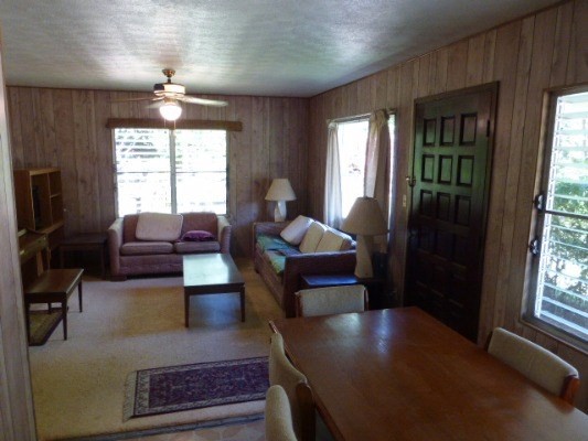 4971 Hekili Road Kapaa, HI 96746 - Photo 6 of 11 a living room with furniture and a chandelier