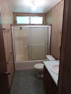 4971 Hekili Road Kapaa, HI 96746 - Photo 8 of 11 a bathroom with a sink a toilet and shower