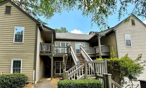 a front view of a house with stairs