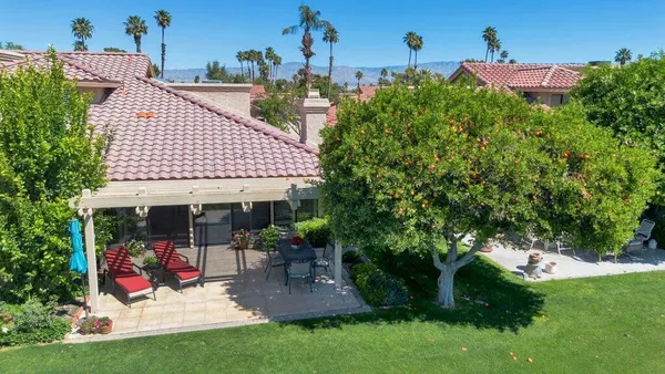 a view of a lake with houses in the background