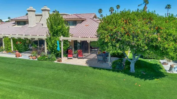 aerial view of a house with outdoor space