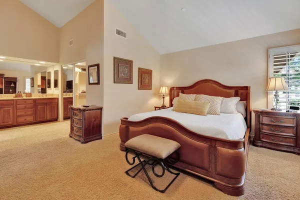 a bedroom with a bed and furniture