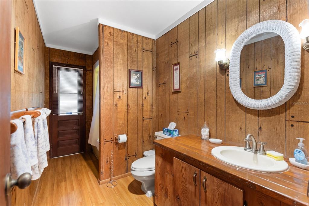 3641 Turtle Mound Road Melbourne, FL 32934 - Photo 33 of 77 a bathroom with a granite countertop sink mirror vanity and toilet