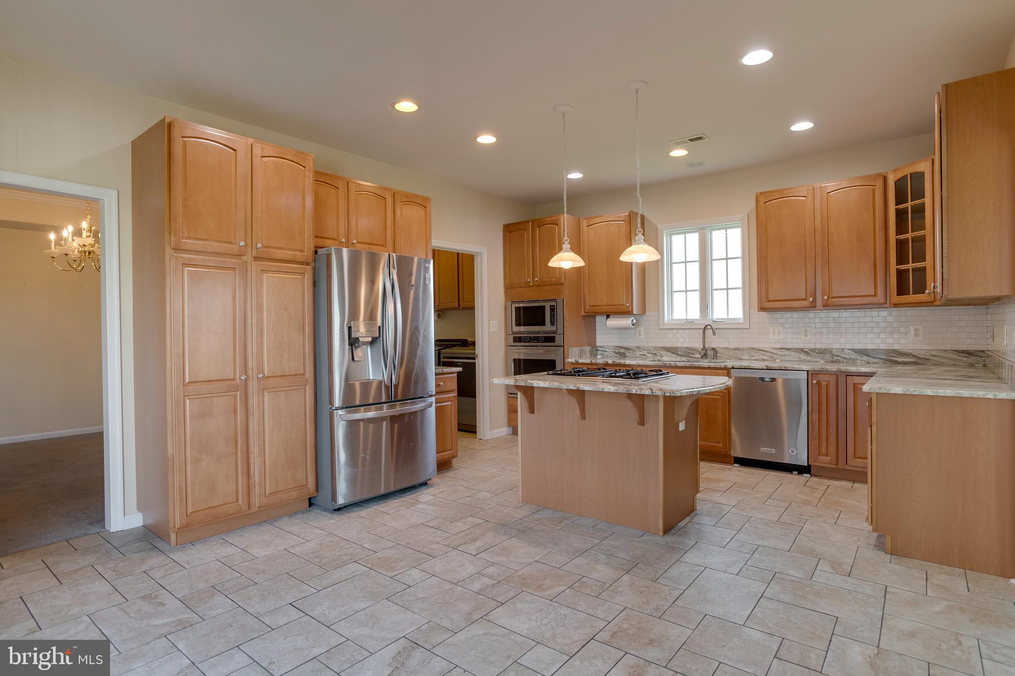 14308 South Hall Court Culpeper, VA 22701 - Photo 9 of 78 a kitchen with stainless steel appliances granite countertop a refrigerator and a sink