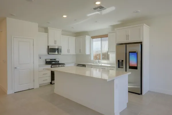 a view of kitchen and a window