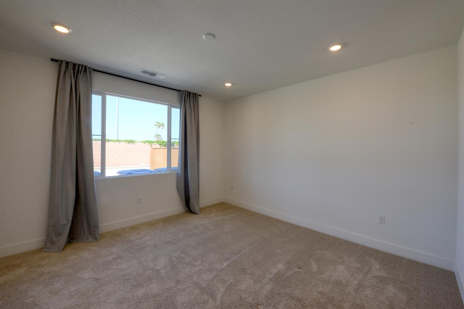 2109 Blossom Ranch Road Patterson, CA 95363 - Photo 18 of 33 a view of an empty room with a window