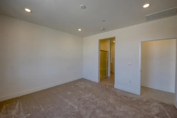 a spacious bathroom with a shower and a sink