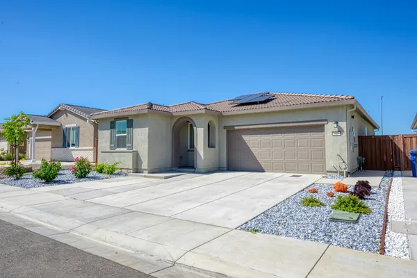 a front view of a house with a garage