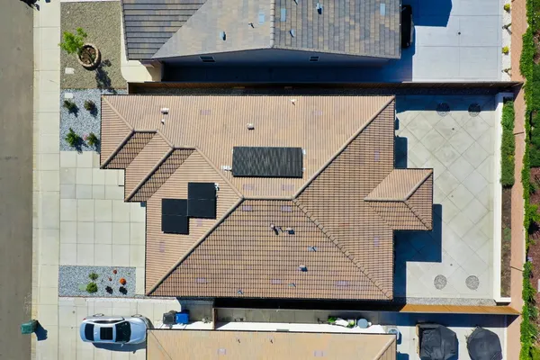 an aerial view of a house with a ocean view