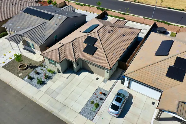 an aerial view of a houses with outdoor space