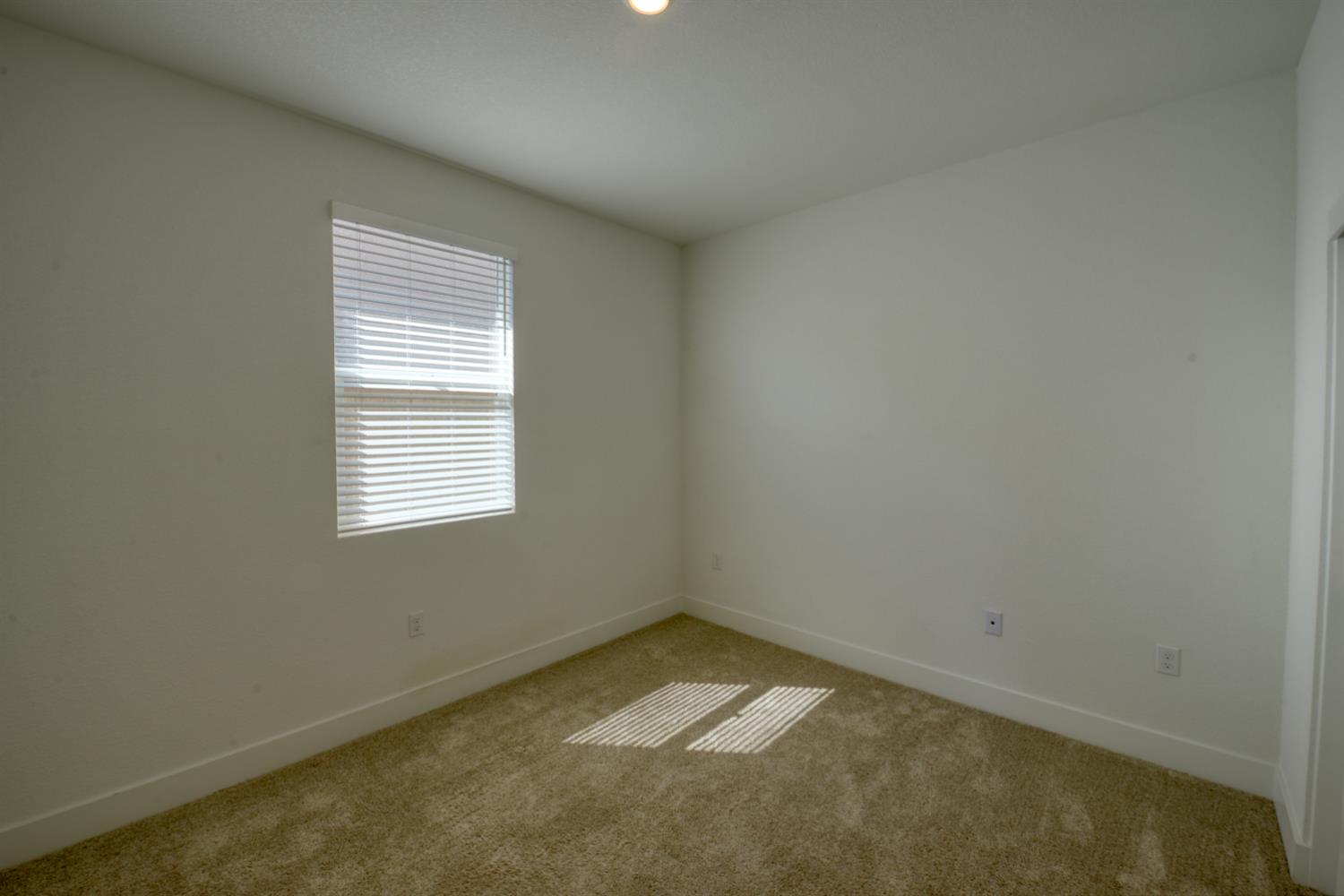 2109 Blossom Ranch Road Patterson, CA 95363 - Photo 7 of 33 an empty room with a window