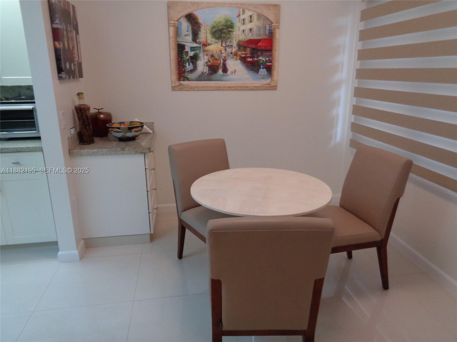 701 Southwest 141st Avenue, Unit 412R Pembroke Pines, FL 33027 - Photo 15 of 52 a view of a room with furniture and wooden floor