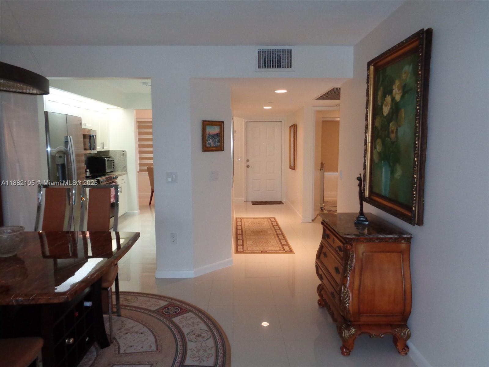 701 Southwest 141st Avenue, Unit 412R Pembroke Pines, FL 33027 - Photo 24 of 52 a living room with furniture and a window
