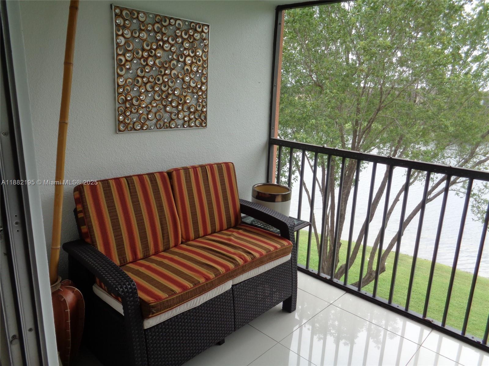 701 Southwest 141st Avenue, Unit 412R Pembroke Pines, FL 33027 - Photo 28 of 52 a view of two chairs in the balcony