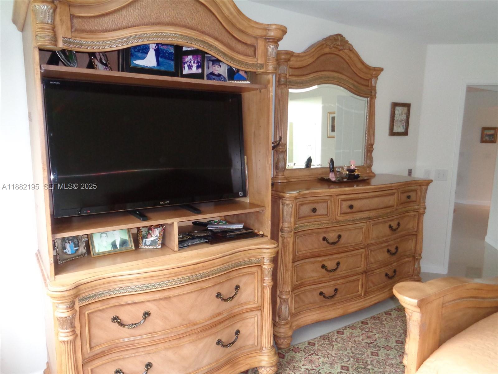 701 Southwest 141st Avenue, Unit 412R Pembroke Pines, FL 33027 - Photo 32 of 52 a bathroom with a sink and a mirror