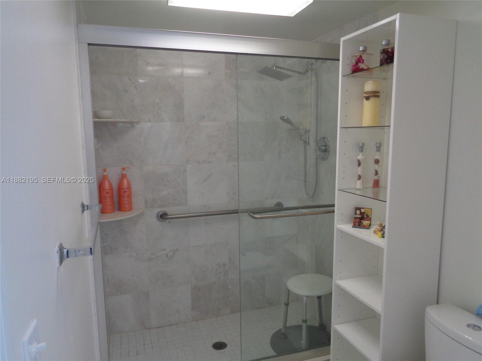 701 Southwest 141st Avenue, Unit 412R Pembroke Pines, FL 33027 - Photo 35 of 52 a bathroom with a shower