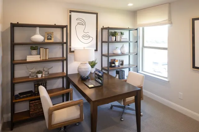 a view of a workspace with furniture