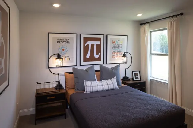 a bed room with a bed and a window