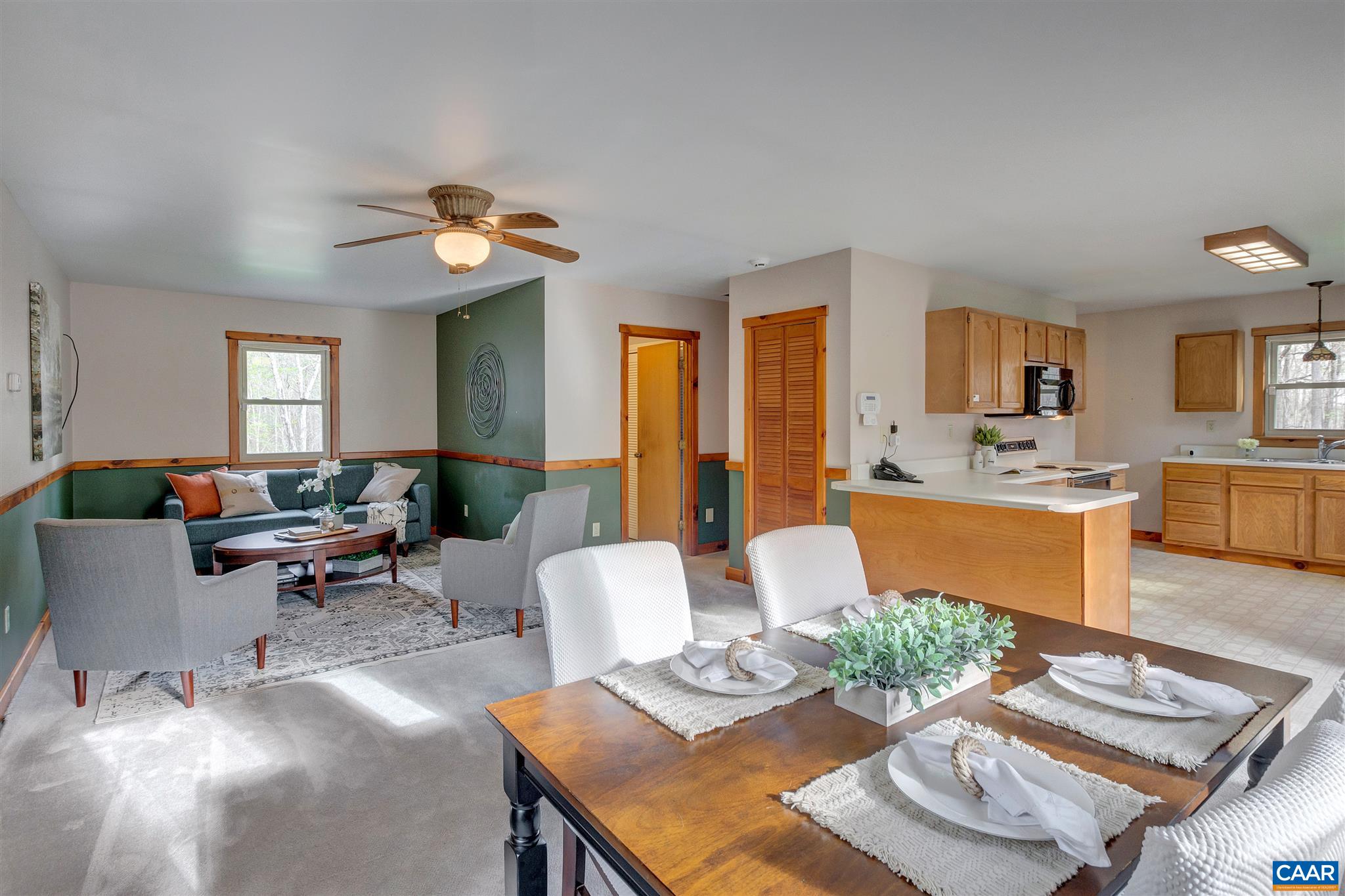 1253 Axtell Road Howardsville, VA 24562 - Photo 24 of 51 a living room with furniture kitchen view and a dining table