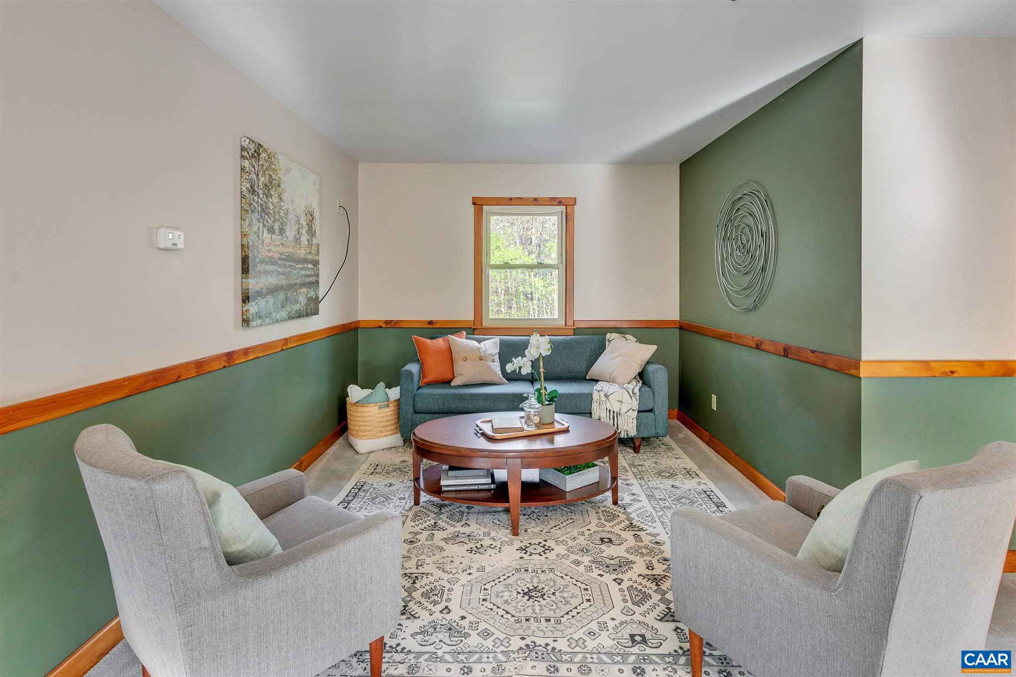 1253 Axtell Road Howardsville, VA 24562 - Photo 25 of 51 a living room with furniture and a window