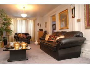 896 Eastern Parkway Brooklyn, NY 11213 - Photo 2 of 8 a living room with furniture and a large window