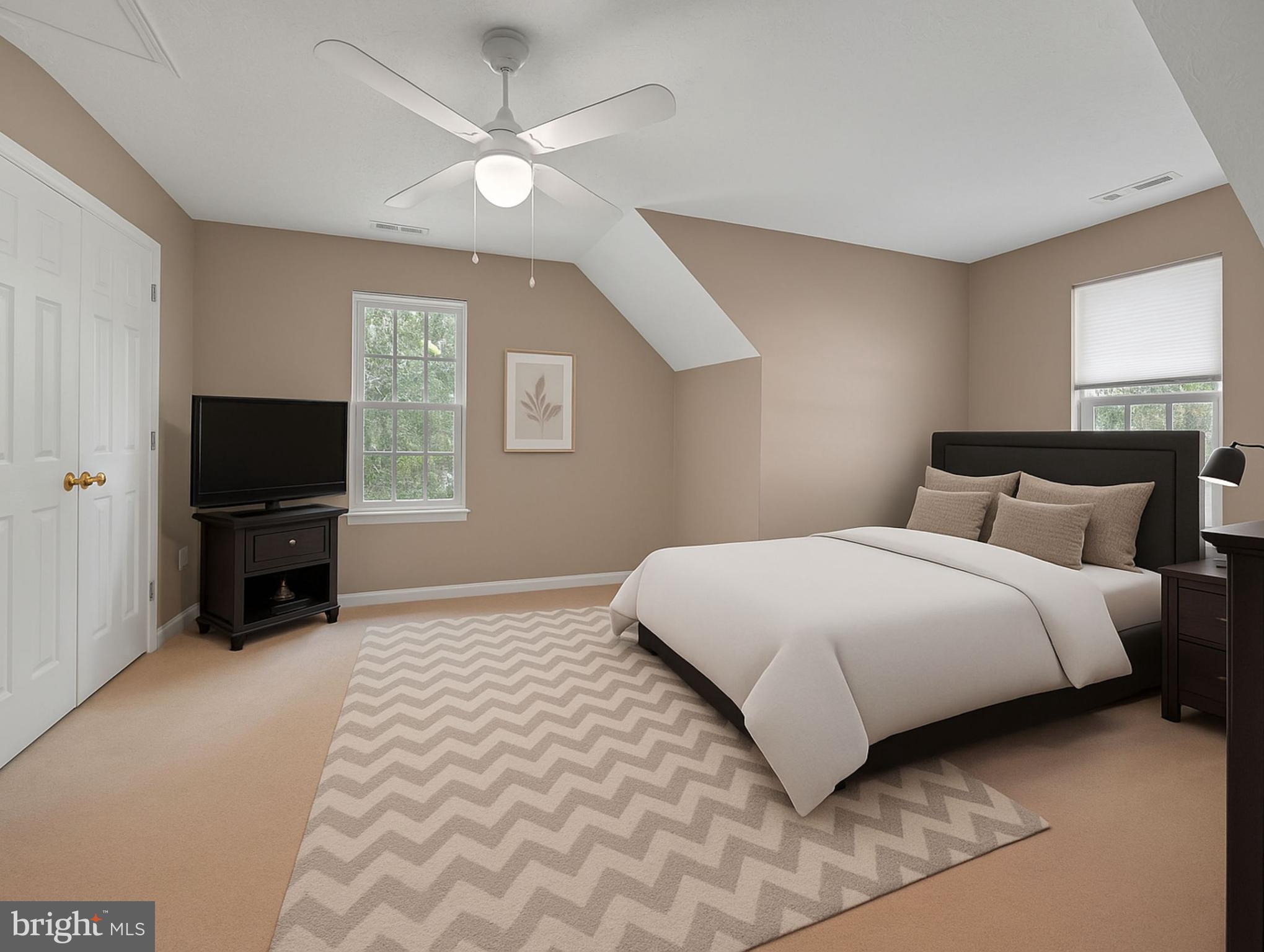 11535 Honeysuckle Court Issue, MD 20645 - Photo 13 of 21 a bedroom with a bed and a flat screen tv