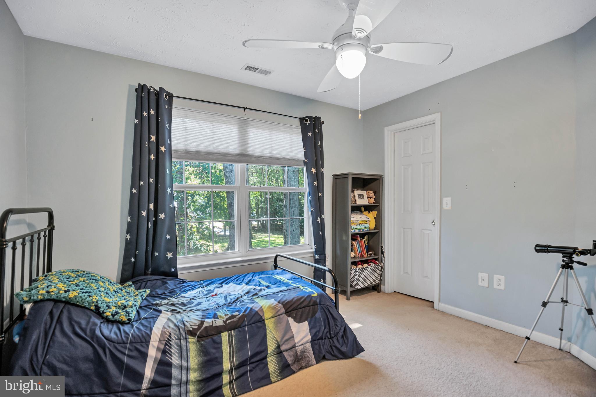 11535 Honeysuckle Court Issue, MD 20645 - Photo 14 of 21 a bedroom with bed and wooden floor