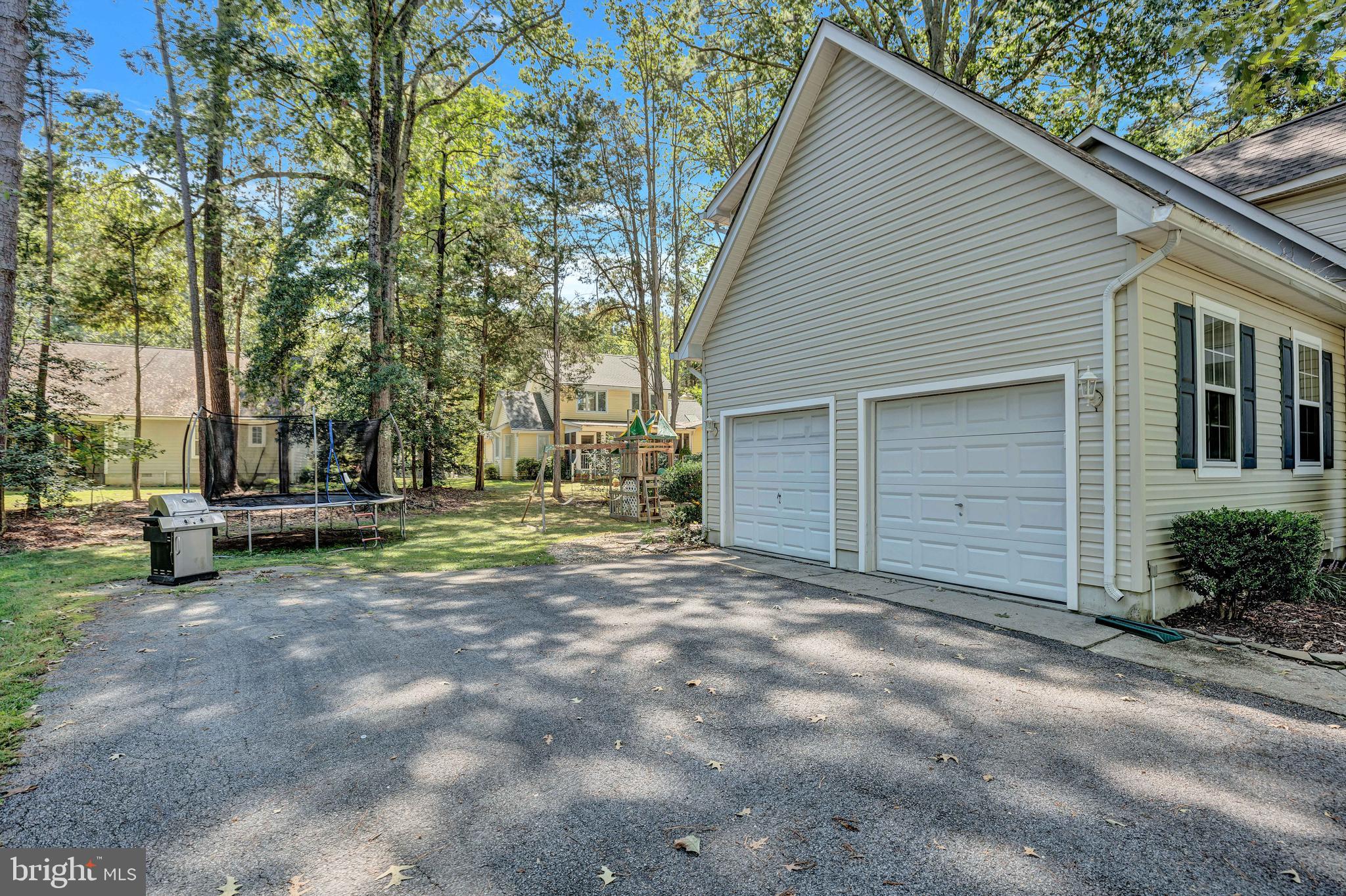 11535 Honeysuckle Court Issue, MD 20645 - Photo 19 of 21 a view of a house with a yard and tree s