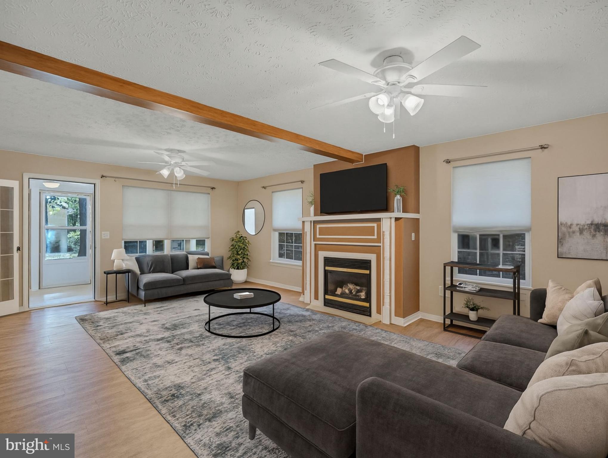 11535 Honeysuckle Court Issue, MD 20645 - Photo 3 of 21 a living room with furniture and a fireplace