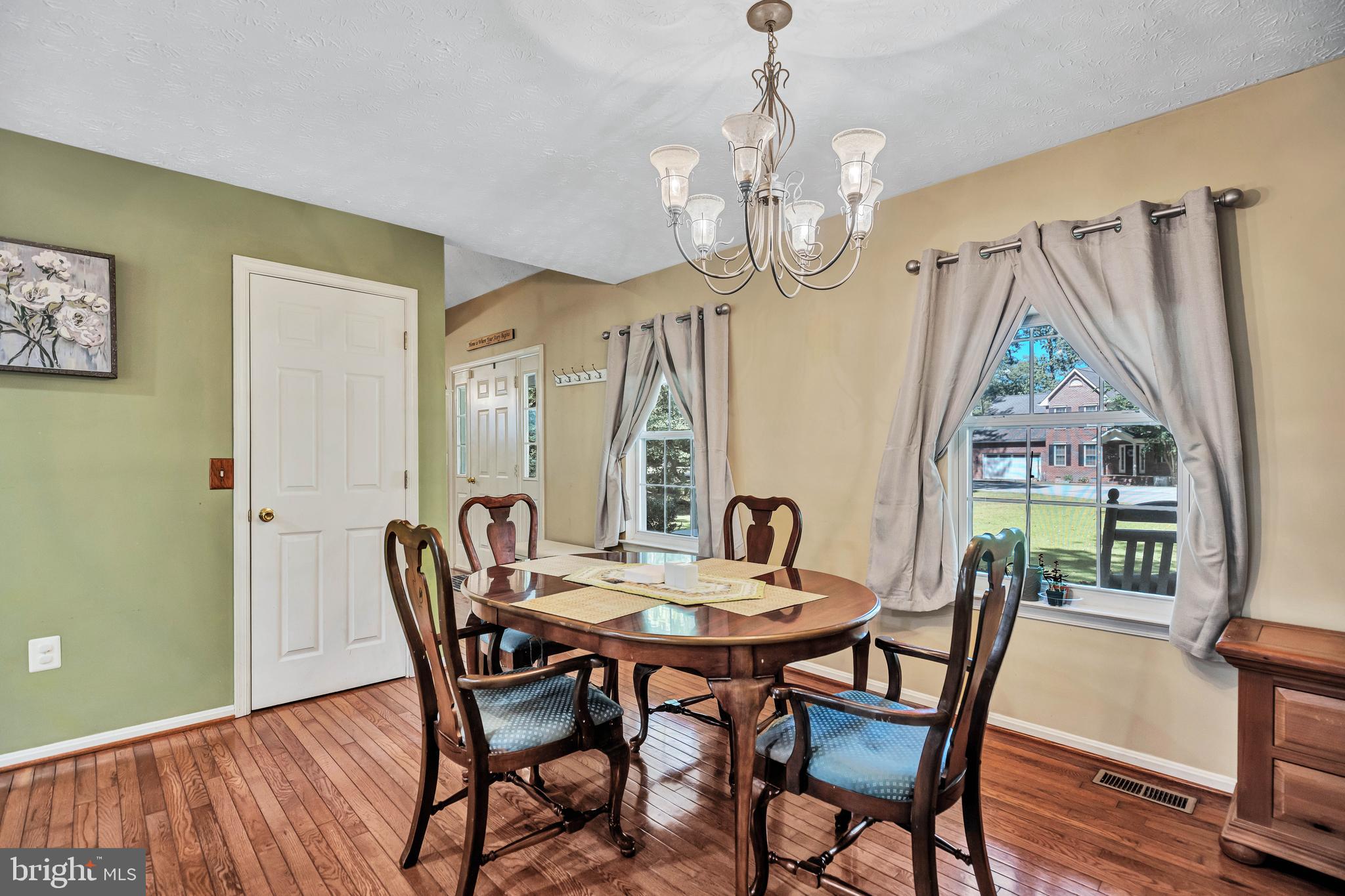 11535 Honeysuckle Court Issue, MD 20645 - Photo 4 of 21 a view of a dining room with furniture window and wooden floor
