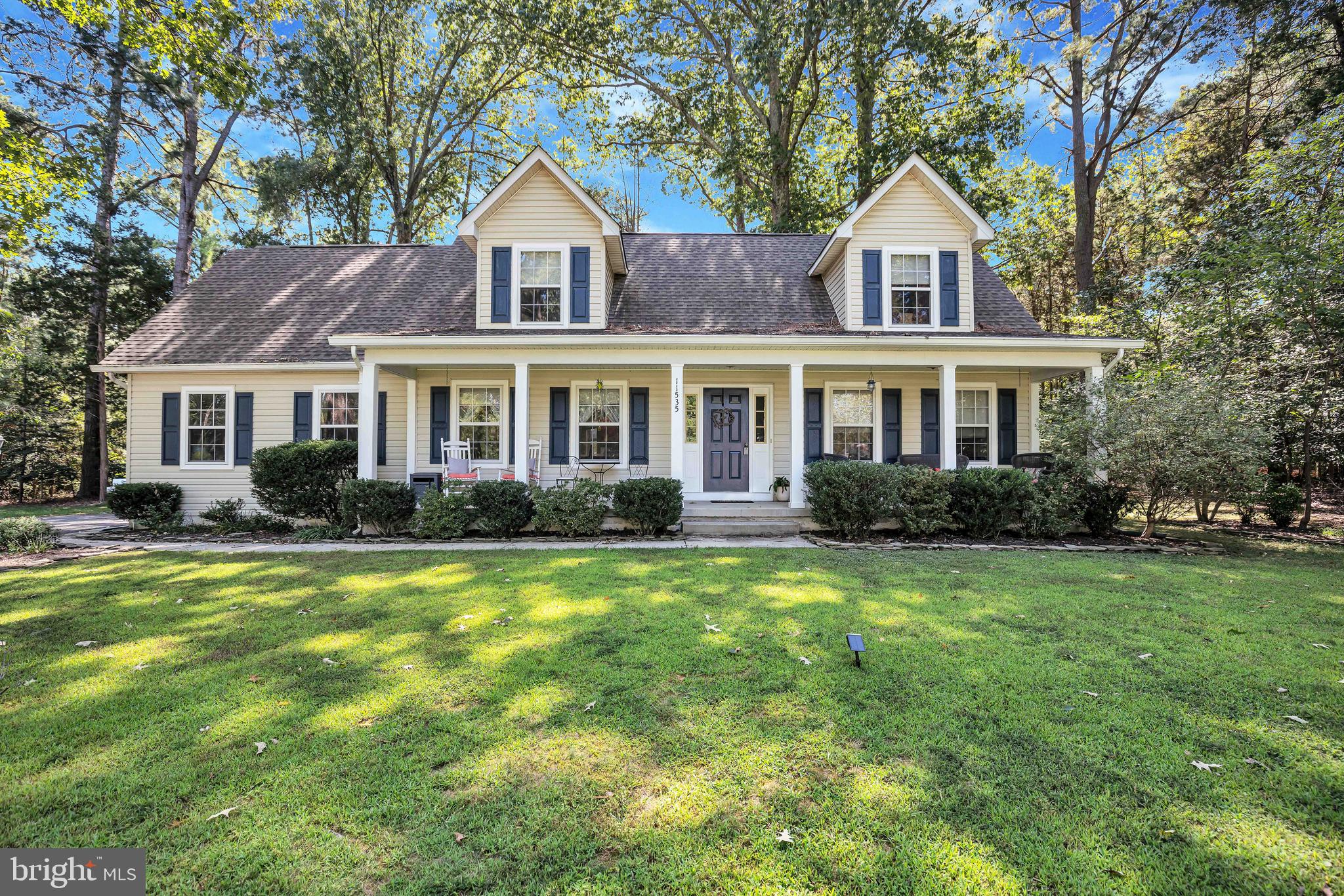 11535 Honeysuckle Court Issue, MD 20645 - Photo 6 of 21 a front view of a house with a yard and trees