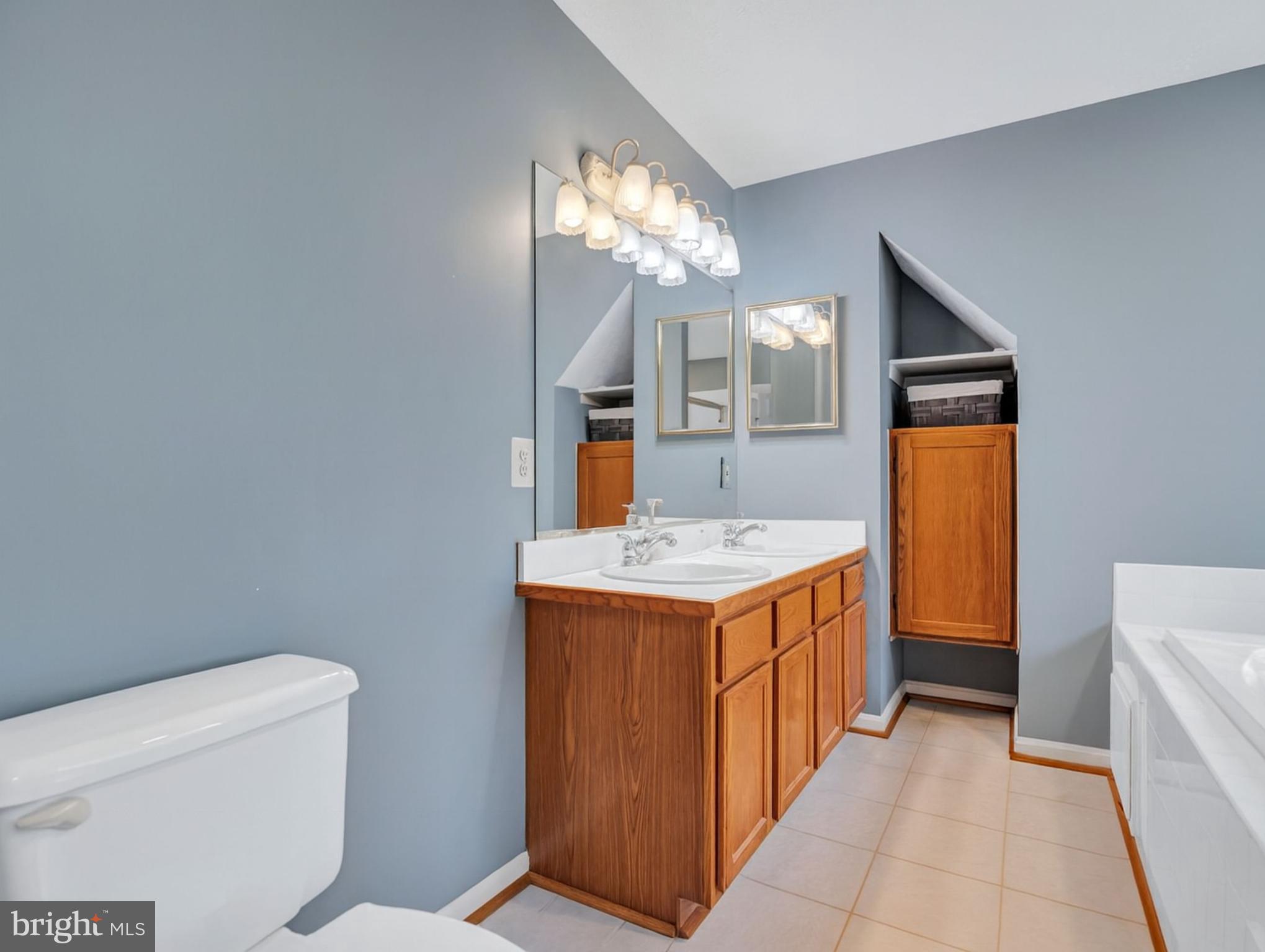 11535 Honeysuckle Court Issue, MD 20645 - Photo 10 of 21 a kitchen with a stove and a refrigerator