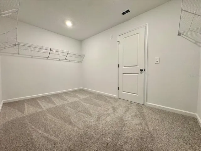 a view of a room with racks on the wall