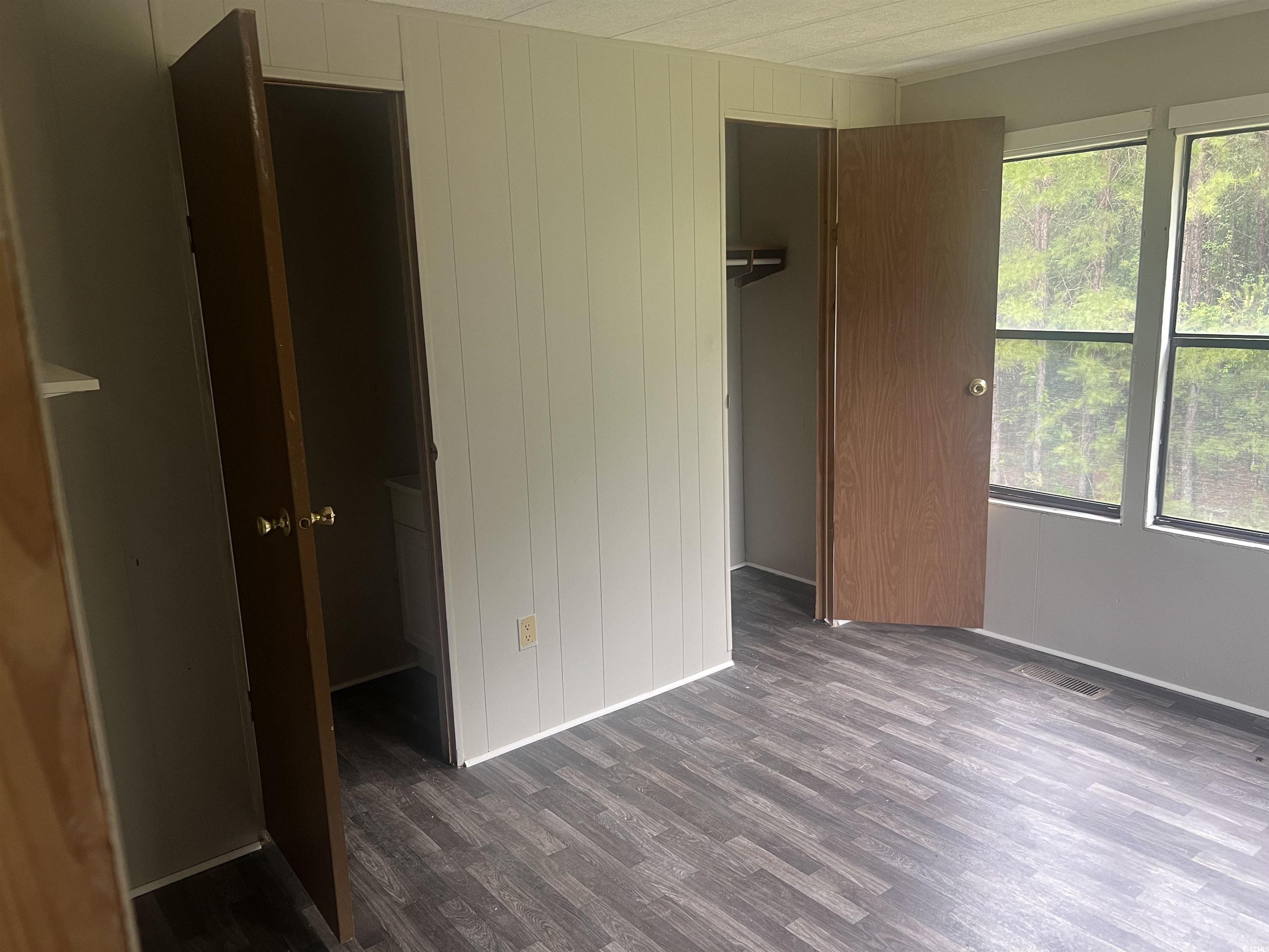 4675 Brailsford Circle Rembert, SC 29128 - Photo 11 of 20 Empty room with ornamental molding, dark wood fini