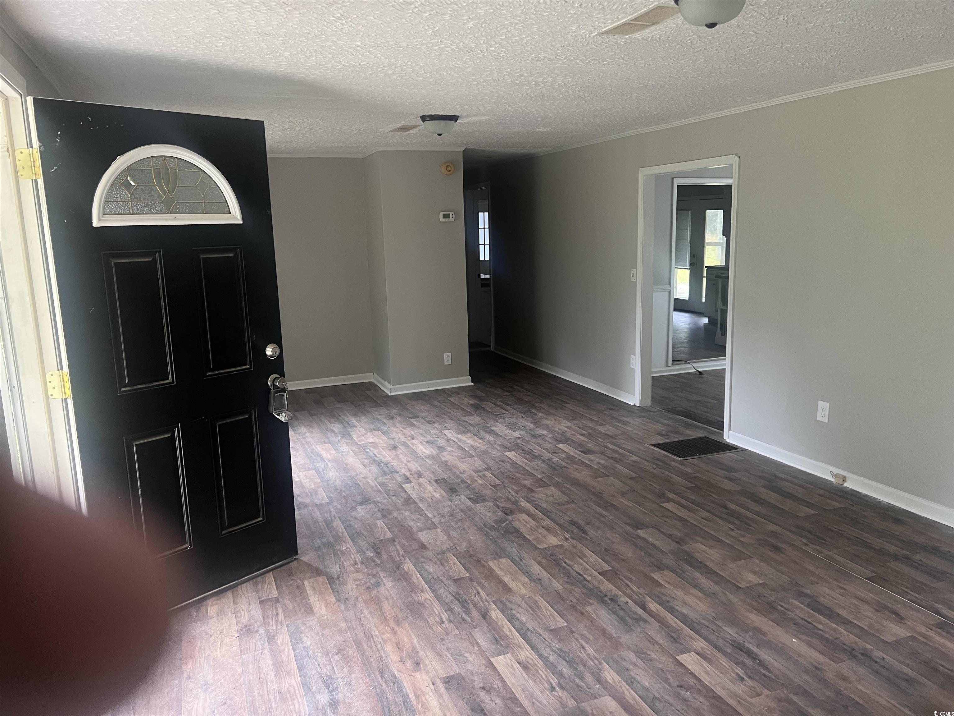 4675 Brailsford Circle Rembert, SC 29128 - Photo 2 of 20 Entrance foyer with a textured ceiling, wood finis