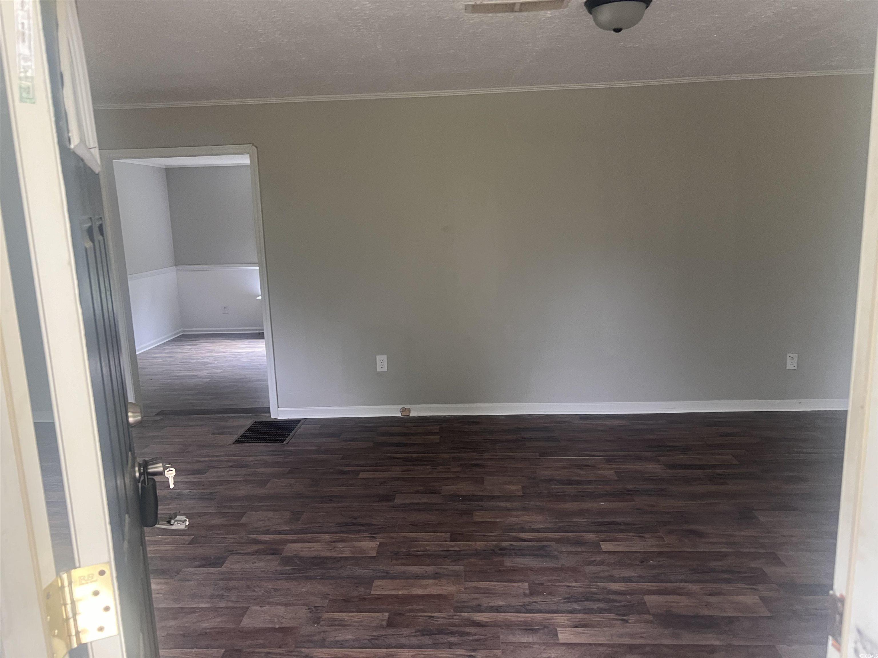 4675 Brailsford Circle Rembert, SC 29128 - Photo 5 of 20 Spare room featuring dark wood finished floors, a