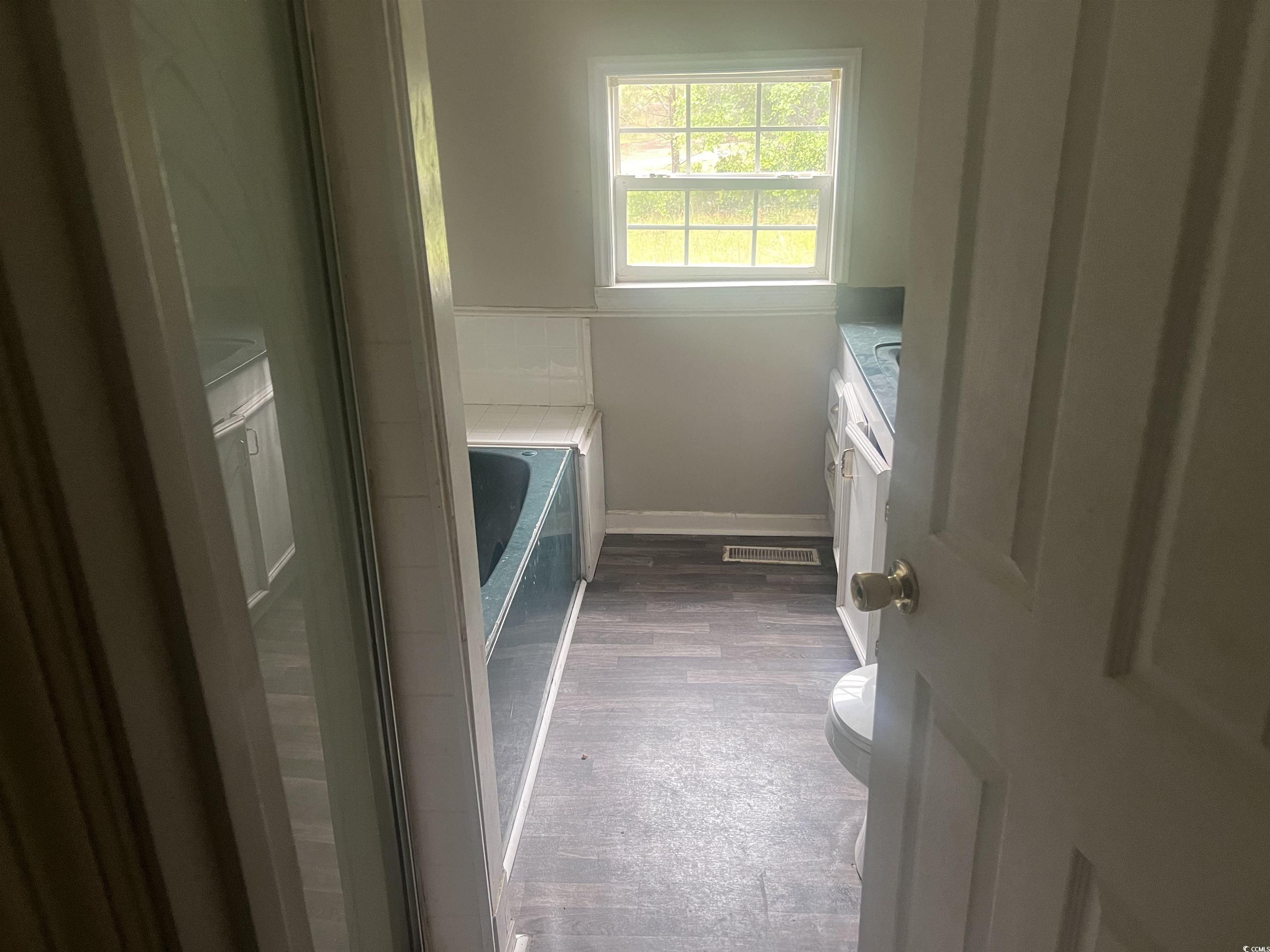 4675 Brailsford Circle Rembert, SC 29128 - Photo 8 of 20 Bathroom featuring vanity, toilet, a garden tub, w